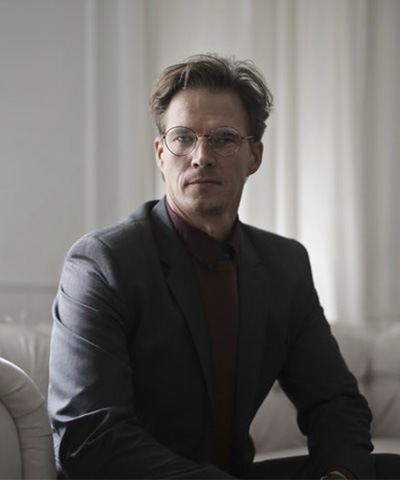 well-dressed-businessman-sitting-on-sofa