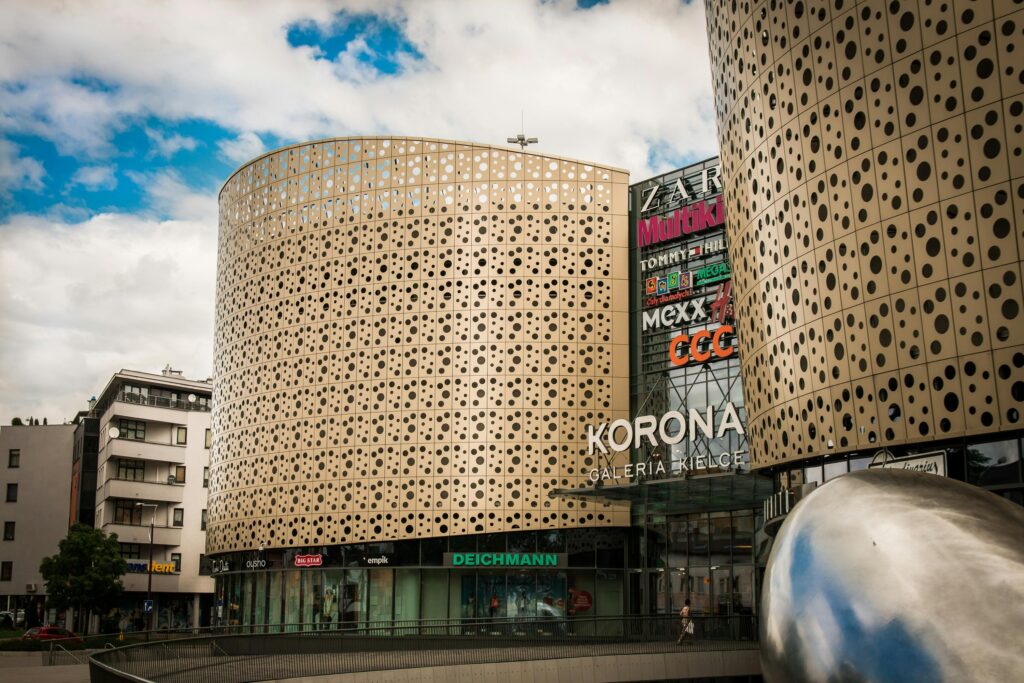 A contemporary shopping mall, Galeria Korona in Kielce, featuring unique architectural design.
